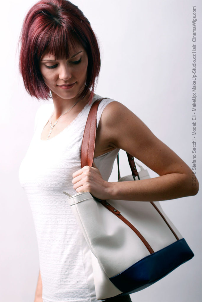 model with a white leather bag